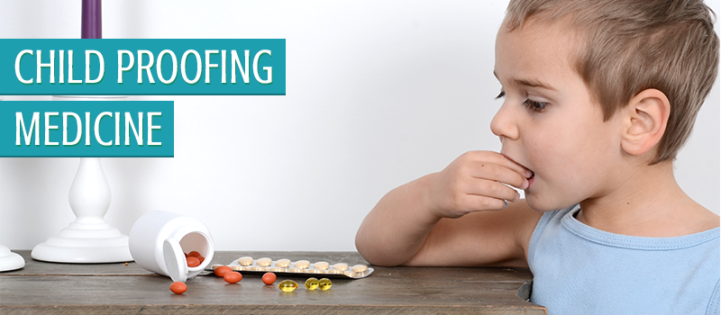 a child that has gotten into some medicine that they should not have and is attempting to eat a pill